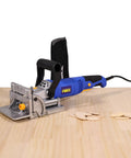 No Sweat Lightweight Electric Biscuit Jointer 760W on a wooden surface with cut wood pieces nearby, designed for quick joinery.
