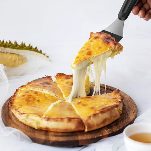 Close-up of small metal mini serving spatula with black handle lifting a slice of cheese pizza.