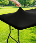 Stretchy Spandex 6 Foot Rectangle Tablecloth With Elastic Edges For A Snug Fit, Washable Outdoor Table Cover shown on table