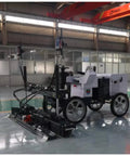 Automated Concrete Screed Machine For Warehouse Flooring And Paving Workhorse Heavy Duty Multi Config Structural Grading Tool With Autonomous Spatial Reference Perfect For Farm Construction And Land Management Jobs, white wheeled unit on warehouse floor