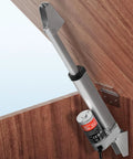 VEVOR 12V linear actuator with mounting bracket, installed on a wooden cabinet door; gray metal body.