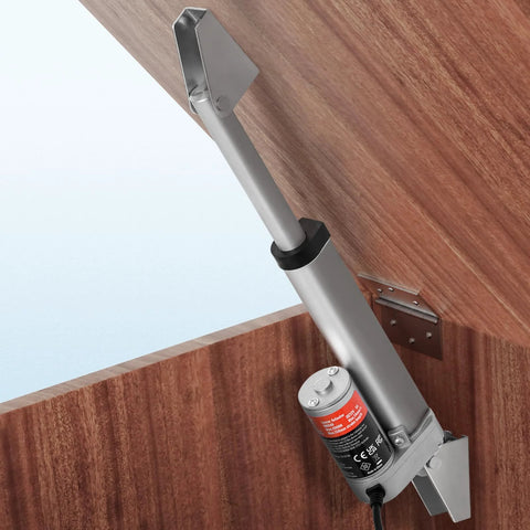 VEVOR 12V linear actuator with mounting bracket, installed on a wooden cabinet door; gray metal body.