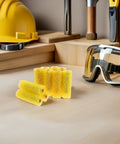 Forty Heavy Duty Paint Texture Sponge Rollers For Nailing Perfect Embossed Wall Finishes On Gnarly Surfaces With An Elastic Grip that shows a pack of yellow rollers beside safety goggles.