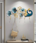 Sleek Wall Mounted Coat Rack With Extended Hook Arms For Entryway, designed with artistic blue and gold ginkgo leaves and a bag hanging.
