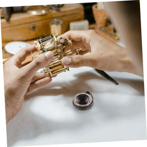 Hands assembling Vintage Mechanical Alarm Clock Repair Kit With Steel Spring Drill Press Quill Pro Grade Clock Components And Winding Key