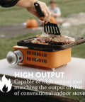 Butane Camp Stove For Hiking And Camping From The Crate Series, Portable Mini Gas Stove With Spiral Flame in use on table