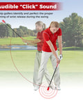 Golfer using Click Stick Golf Swing Trainer With Audible Feedback on a green course to improve swing timing.