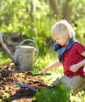 Child using green shovel from 18 Piece Colorful Garden Shovel Set For Teens And Adults Mini Metal Hand Trowels In Garden