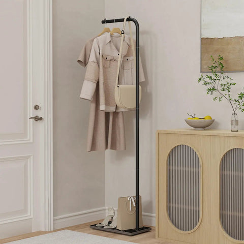 Freestanding Metal Coat Rack With Inverted L Shaped Design And Rock Solid Base Heavy Duty And Stable Clothing Tree For Bedroom Hallway Or Office About 71 Inches Tall Black Finish displaying coats and bags