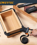 Strap Clamp Set For Woodworking With Quick Release Levers, Ergonomic Handle, Adjustable Picture Frame Clamp in use on wooden box