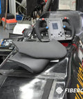 Close-up of a carbon fiber reinforced PET piece on a black racing car, showcasing Carbon Fiber Reinforced PET 3D Printing Filament 1.75mm 0.5kg Black PET-CF17 High Stiffness For Jigs And Fixtures Fast Printing Excellent Printability Wide Printer Compatibility For Strong Durable Parts.