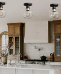 Kitchen with Modern Farmhouse 1 Light Flush Mount Ceiling Light With Clear Glass Globe In Black And Gold Finish Installed