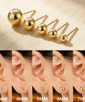 Five Piece Gold Ball Stud Earrings Set For Women Including 3mm 4mm 5mm 6mm And 7mm Sizes, 14K Gold Plated With 316L Steel Pins, Super Versatile Everyday Earrings displayed in five sizes on ear