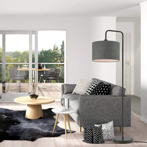 Barden 58 Inch Floor Lamp in Black Finish With Dark Gray Velvet Shade next to gray sofa in modern living room setup