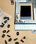 Twenty Pack Black T Slot Nuts For One Quarter Inch By Twenty Threads displayed with aluminum extrusion and ruler