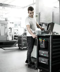 Man using 2Go 4 Tool Quiver Compact Tool Belt Organizer in workshop for quick access and heavy-duty durability, multiple pockets.
