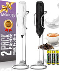 Two Pack Handheld Milk Frother With Stand For Lattes Cappuccinos Matcha And Hot Chocolate Go To Valentines Day Gift For Him And Her Black And White; includes two frothers, stands, coffee beans, cup of cappuccino, batteries.
