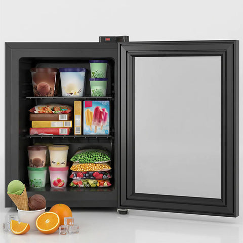 3.0 Cu Ft Upright Freezer With Clear Glass Door Sleek Black Cabinet filled with ice creams, frozen meals, and vegetables.