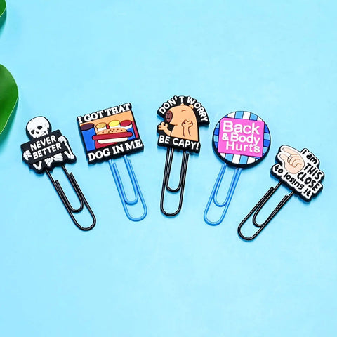 Cheeky 30 Pack Large Funny Paper Clips Set For Office Work Planners with humorous designs on blue background.