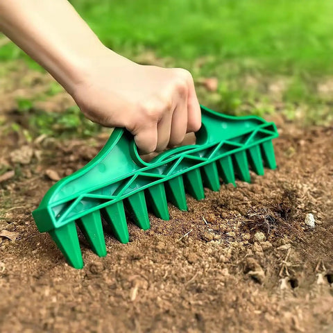 Hand using 12 Hole Digger Seed Spreader 7 Piece Seed Sowing Dispenser Set Tiny Handheld Seed Planter in soil, green plastic