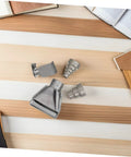 High Grade Stainless Steel Heat Gun Nozzle Set For Plastic Welding And Shrink Wrap Repair With Easy Swap Design and Energy Efficient Airflow displayed on wood surface.