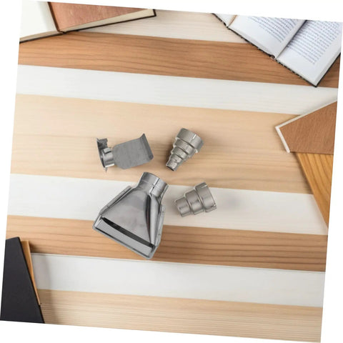 High Grade Stainless Steel Heat Gun Nozzle Set For Plastic Welding And Shrink Wrap Repair With Easy Swap Design and Energy Efficient Airflow displayed on wood surface.