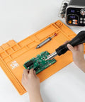 Pro Grade Heat Resistant Silicone Soldering Mat Withstands 932 Degrees Fahrenheit, 17.7 by 11.8 Inches used for electronics soldering.