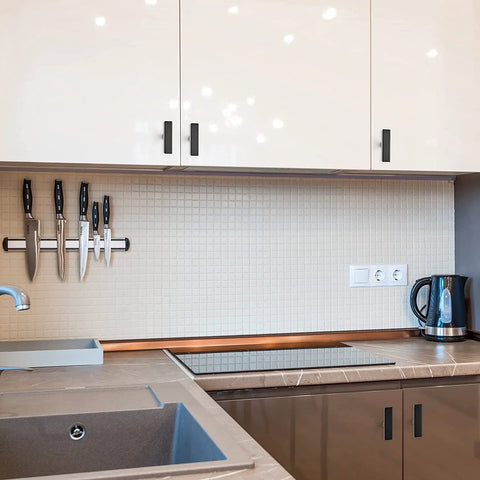 Modern kitchen with 10 Pack Black Square Bar Cabinet Knobs 2 Inch Matte Black Single Hole Kitchen Cabinet Pulls on white cabinets.