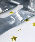 Close-up of 25 Party Favor Bags For Kids Birthday Parties With Star Pattern In 5 Colors, Durable Reusable Goodie Bags For Candy Treats.