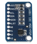 16 Bit I2C Analog To Digital Converter Board with labeled ports and components, 16-bit resolution, compact blue module design.
