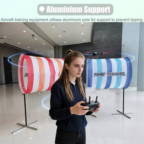 Person operating remote control near DIY Drone Obstacle Course Kit For FPV Racing, Beginner Friendly Practice Set with cloth obstacles.
