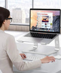 Person using Detachable Aluminum Laptop Stand For Desk, Ultra Stable Mount Fits 10 To 16 Inch Laptops Like MacBook Air Pro