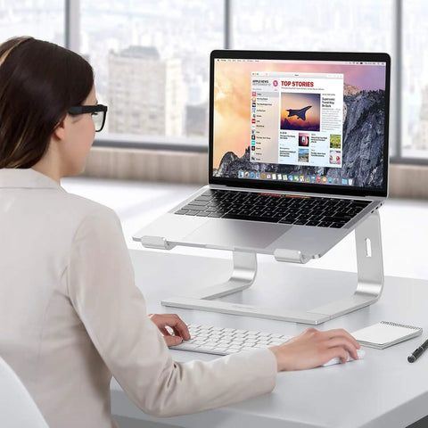 Person using Detachable Aluminum Laptop Stand For Desk, Ultra Stable Mount Fits 10 To 16 Inch Laptops Like MacBook Air Pro