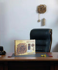 Gear Globe Wall Clock Kit With 369 Laser Cut Pieces displayed on a wooden desk in an office setting.
