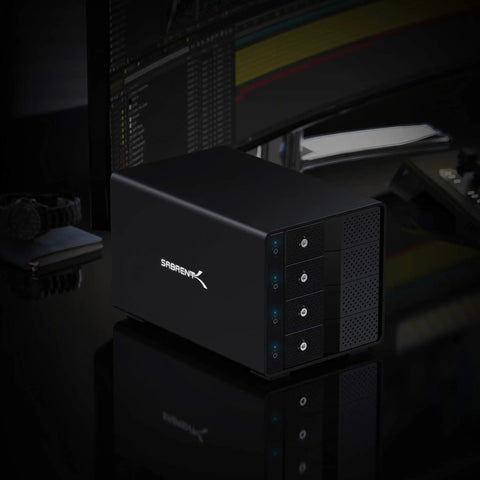 Heavy Duty Four Bay USB C Docking Station For External Hard Drive Enclosure And SSD HDD Expansion With Blazing Fast 10Gbps Transfer Speeds Built Tough Multi Drive Access on a desk with dark background.