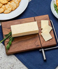 Cheese Slicer Kit Stainless Steel Finish No Fuss Arm Install And Wire Cutter For Smooth Slices In Minutes displayed with cheese on board