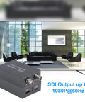 Dont Sweat The Cable Crunch With This HDMI To SDI Converter featuring dual SDI outputs and USB power in a living room setting.