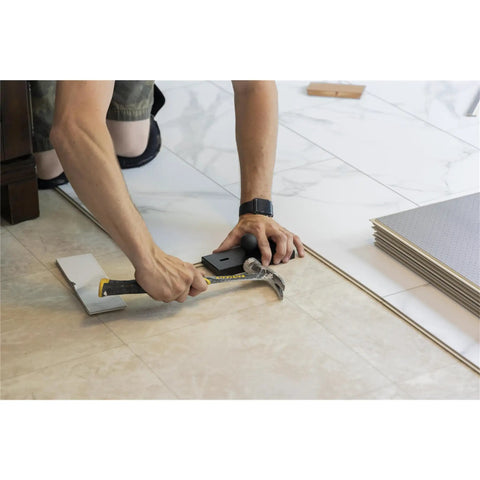 Person using Bullet Pro Length Tapping Block for vinyl laminate tile flooring extra length for longer planks Made in USA Tool 711P.