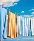 Solid Forty Eight Pc Heavy Duty Plastic Clothespins Set With Assorted Vibrant Hues Includes Sweet Mesh Storage Pouch To Keep Laundry Day Hangin Easy For Towels Crafts Garden Clips And Home Organization, colorful clips holding clothes on a line against a blue sky.