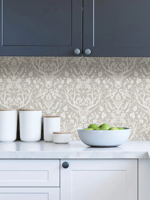 Kitchen with taupe forest peel and stick wallpaper for walls DIY friendly removable self adhesive decor with damask pattern behind counter.