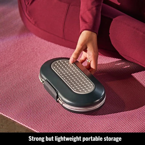Person holding Portable Travel Lock Box With Four-Digit Combo, Small Personal Safe For Phones, Passports, Cash And Cards, Secure Your Gear On The Go, Cable Ready And Easy To Use, Gunmetal Grey 5900D on a yoga mat