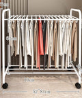 No Sweat Expanding Floor Standing Pants Hanger Rack, 52-81 cm, white metal, holds slacks & shirts, with rolling wheels on tile.