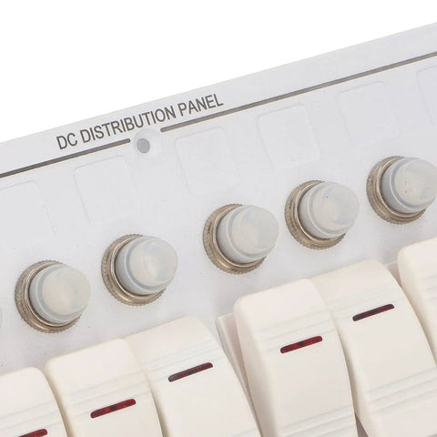 Close-up of Beefy 8 Gang Toggle Switch Panel In Aluminum Alloy With Overload Protector And Red LED Indicator for 12V systems.