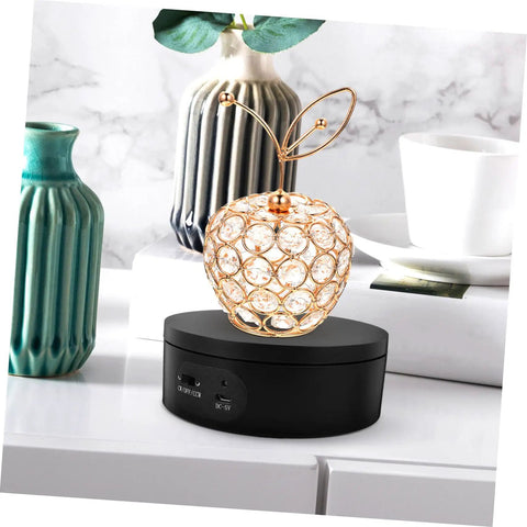 Levemolo Electric Rotating Turntable Display Stand For Jewelry And Watches 360 Degree Spin Base with crystal apple centerpiece.