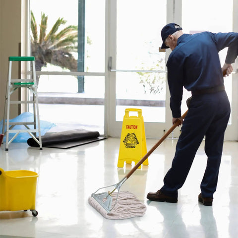 Worker using Industrial Grade 59 Inch Quick Change Mop Stick With Wooden Handle And Steelhead for commercial floor cleaning