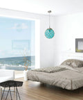 Netted Buoy Coastal Sea Glass Pendant Light With Natural Rope Clear Glass Shade in bedroom with ocean view