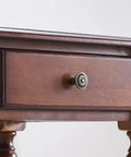 Close-up of a drawer handle on a Retro Brown Computer Desk With Two Smooth As Butter Storage Drawers Absolutely Hella Sturdy Construction.