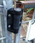 2 Pack Weatherproof Gate Hinges with Safe Spring Mechanism installed on metal gate for outdoor use