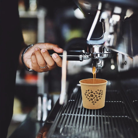 Barista using espresso machine with 4 Oz Espresso Cups 100 Pack Kraft Disposable Paper Cups For Home Office Or Party