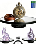 JAYEGT Motorized Rotating Display Stand, 10-Inch Mirror Finish Turntable showcasing a watch, fox figure, and decorative item.